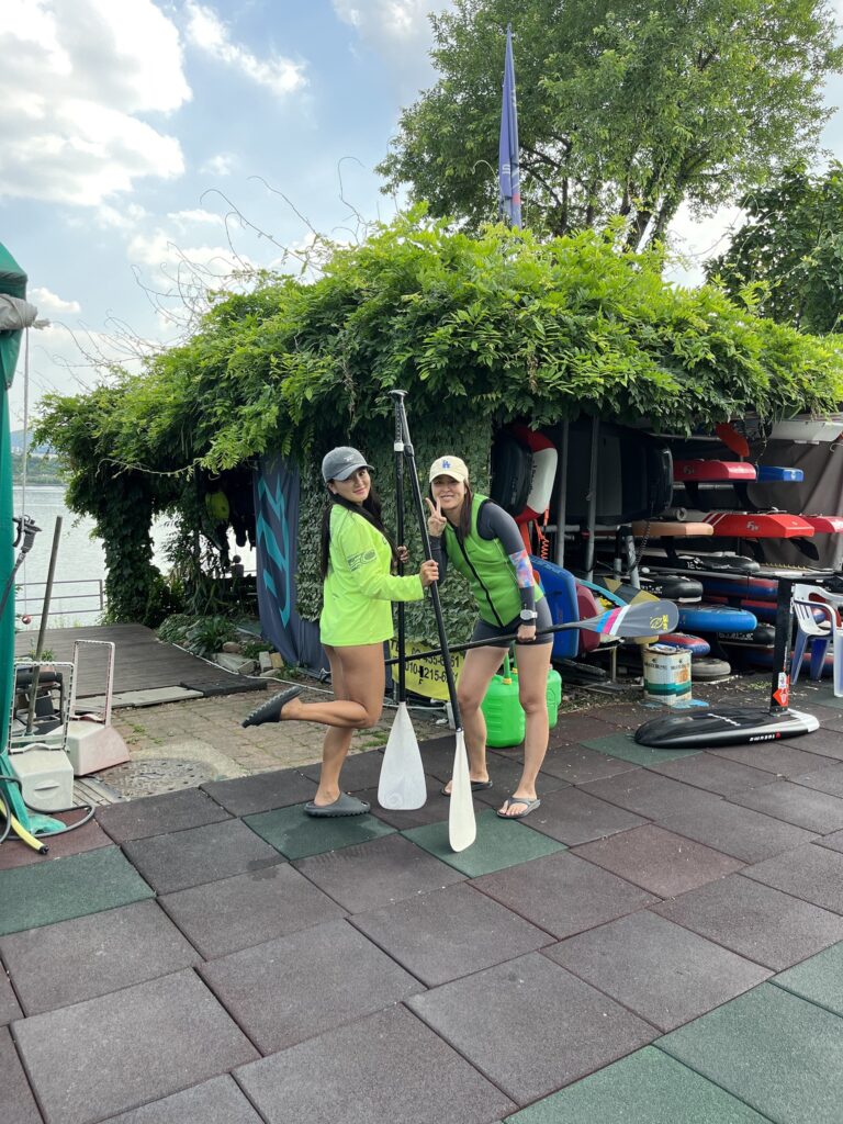 Girls going on a SUP adventure with Hi-Wind on the Han river in the middle of Seoul. Happy and smiling before doing water sport leisure in Seoul South Korea