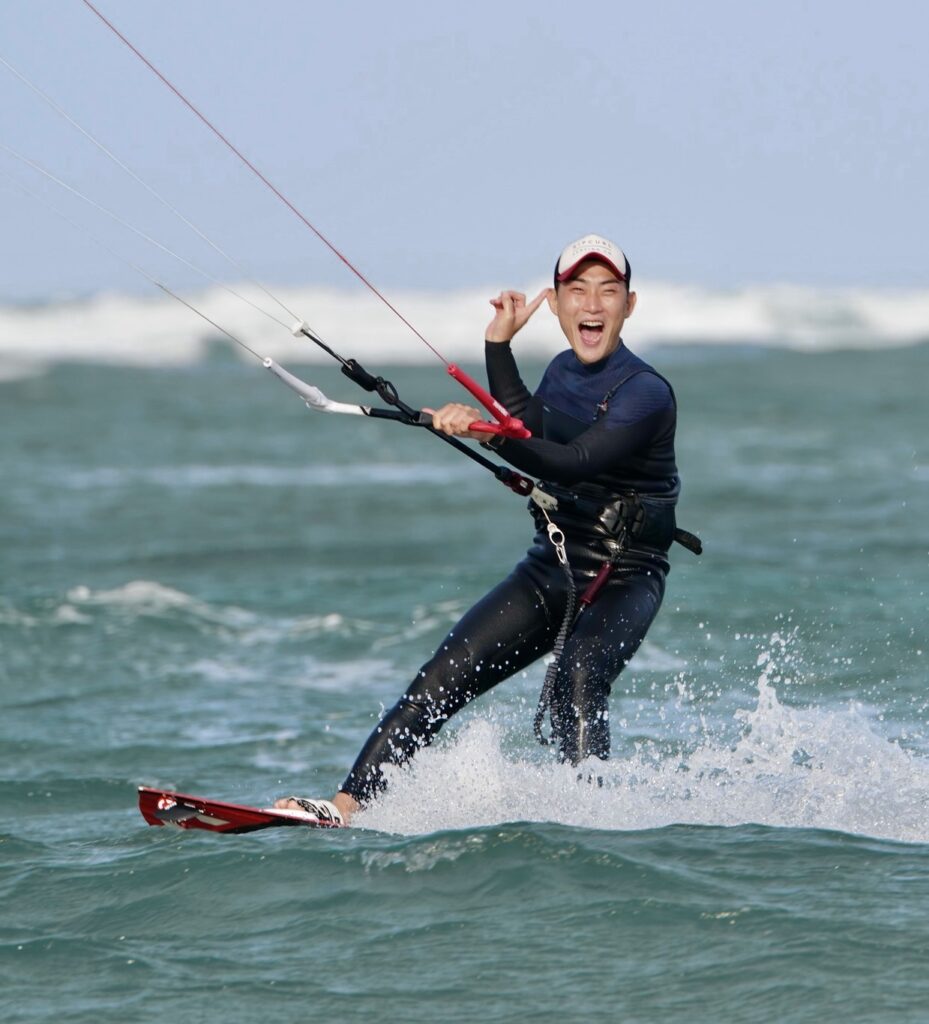 Happy Kitesurfer in kitesurfing in Jeju, South Korea, Kitesurfing. also joining the Vietnam winter camp. Happy sunny weather with blue waters resulting in happy kite students enjoying kiteboarding in Jeju island South Korea and Phan Rang Vietnam