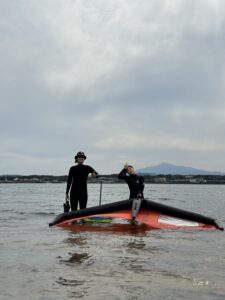 Wing Foil lesson in Jeju South Korea. Smiling student after her first wing foil lesson in Jeju South Korea, Wing Foiling
